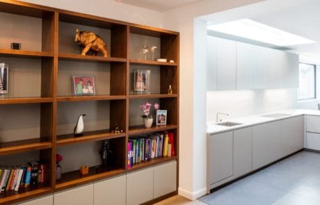 Family library area with open-plan kitchen in Wimbledon - interior remodelling project by QUBED Architecture