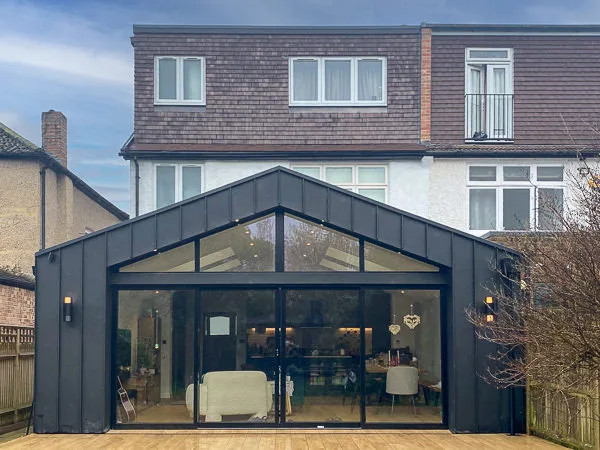 21 Erridge Rd_Rear Elev_3281-Edit Contemporary grey zinc-clad rear extension to a 1930s semi-detached house in Merton Park, SW19